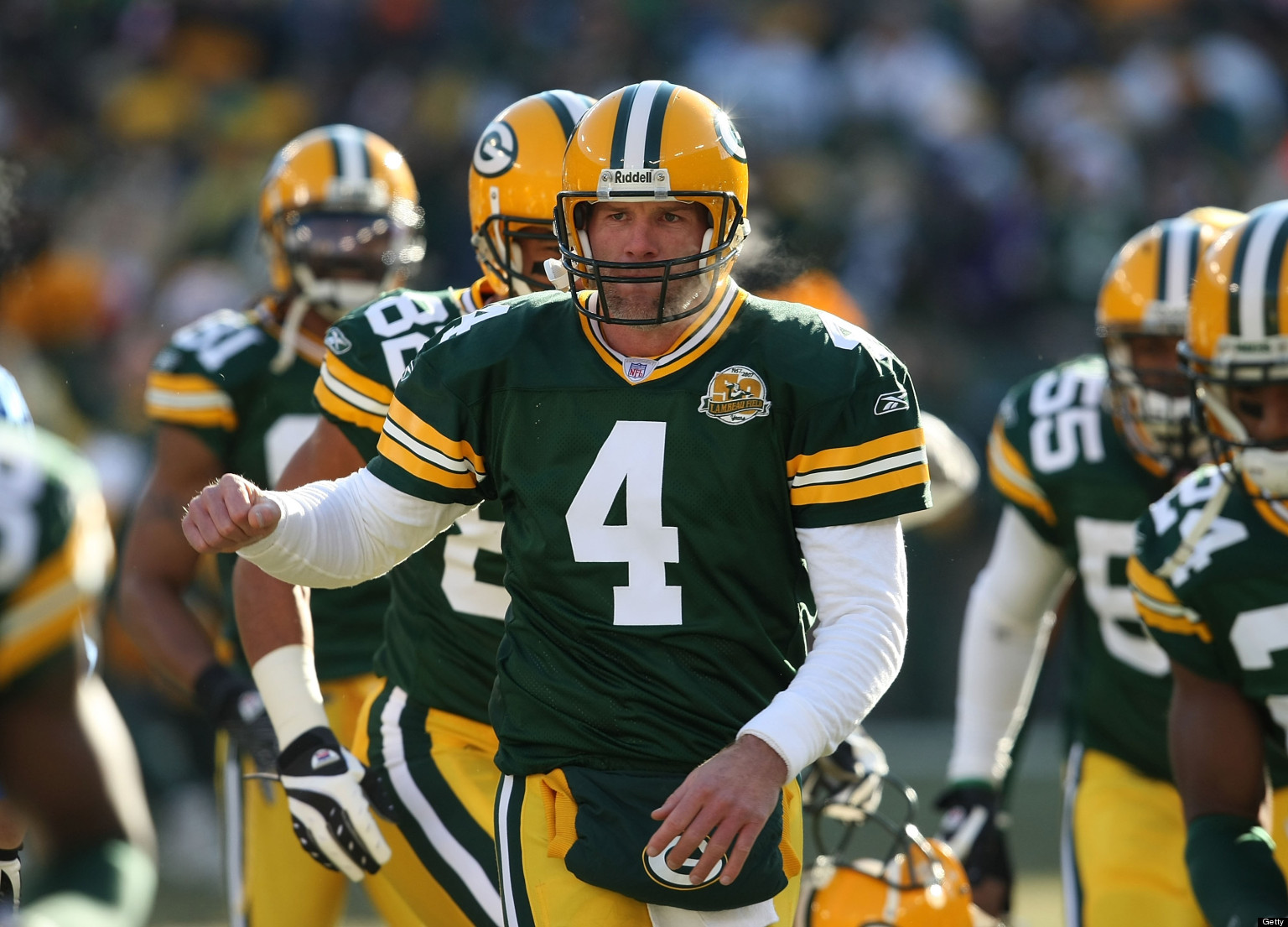 GREEN BAY, WI - DECEMBER 09: Brett Favre #4 of the Green Bay Packers runs onto the field with teammates during player introductions before a game against the Oakland Raiders on December 9, 2007 at Lambeau Field in Green Bay, Wisconsin. (Photo by Jonathan Daniel/Getty Images)