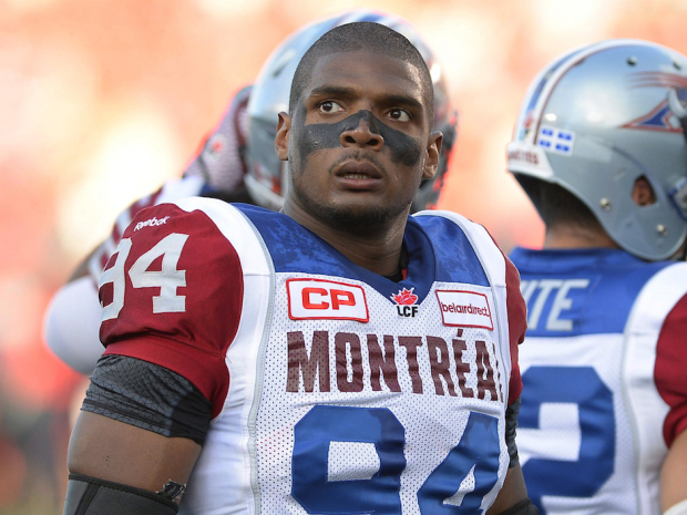 FILE - In this Aug. 7, 2014, file photo, Montreal Alouettes' Michael Sam and teammates warm up for a Canadian Football League game against the Ottawa Redblacks in Ottawa, Ontario. Sam is stepping away from pro football. Sam, the first openly gay player drafted by the NFL, has told the Alouettes that he is leaving the team. He tweeted Friday, Aug. 14, that "The last 12 months have been very difficult for me, to the point where I became concerned with my mental health. Because of this I am going to step away from the game at this time." (Justin Tang/The Canadian Press via AP, File) ORG XMIT: NY160