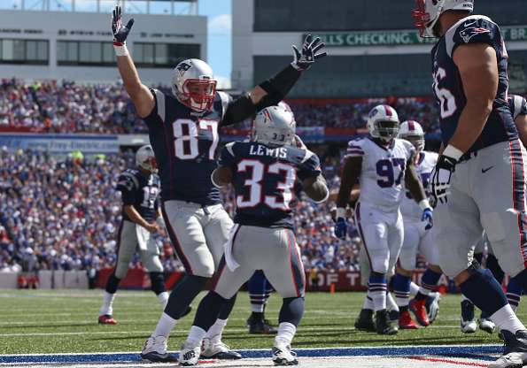 ORCHARD PARK, NY - SEPTEMBER 20: Rob Gronkowski #87 of the New England Patriots congratulates Dion Lewis #22 on his touchdown during NFL game action against the Buffalo Bills at Ralph Wilson Stadium on September 20, 2015 in Orchard Park, New York. (Photo by Tom Szczerbowski/Getty Images) *** Local Caption *** Rob Gronkowski; Dion Lewis