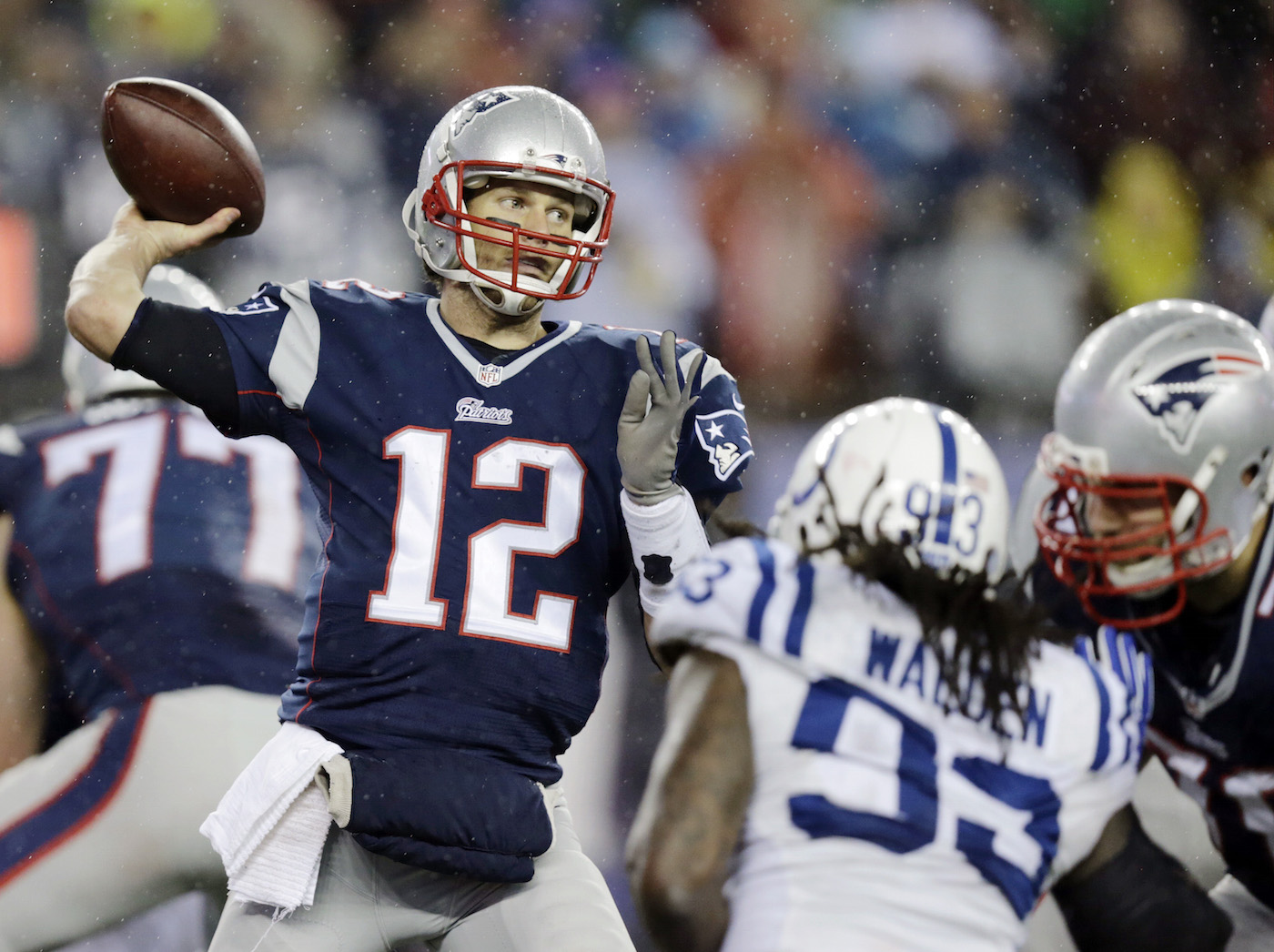 New England Patriots quarterback Tom Brady (12)  passes against the Indianapolis Colts during the second half of the NFL football AFC Championship game Sunday, Jan. 18, 2015, in Foxborough, Mass. (AP Photo/Charles Krupa)